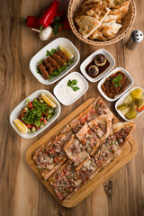 turkish meat pide on wooden table