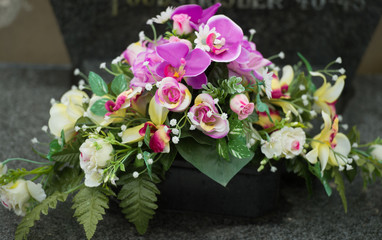Obraz na płótnie Canvas Bouquet of Flowers on European gravesite