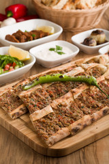 turkish meat pide on wooden table
