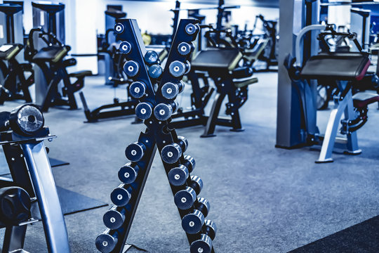 rack with a set of dumbbells in the gym