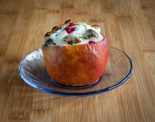 Baked  apples with cottage cheese and berries   on wooden table, high resolution photo