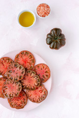 Fototapeta na wymiar Fresh tomato carpaccio with olive oil