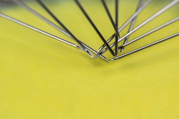 Fototapeta premium a lot of syringes lying next to each other on a yellow background. Vaccination, doping, drugs