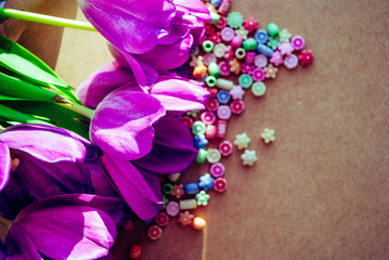 tulips and beads. beads are scattered. spring composition. floral background