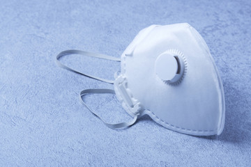 White ffp3 face mask with a valve