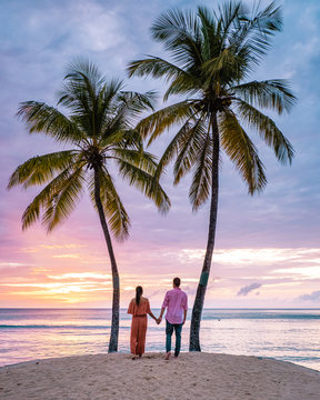 Saint Lucia Caribbean Island, couple on luxury vatation at the tropical Island of Saint Lucia, men and woman by the beach and crystal clear ocean of St Lucia Caribbean Holliday