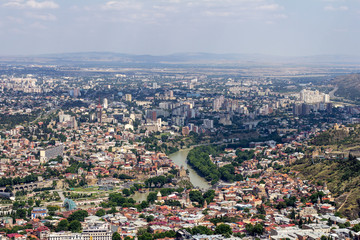 Cityscape of Tbilisi, Georgia as viewed from Mtatsminda View Point. The Holy Trinity Cathedral of...