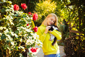 Attractive confident creative good-looking female bonding to cat. Care about animal. Animal clinic concept. Vaccination and sterilization of animals. Caring for health.