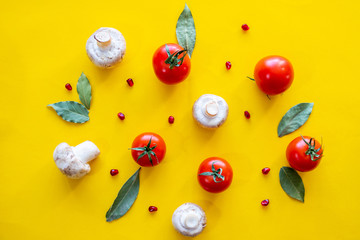 tomatoes and mushrooms on a yellow background