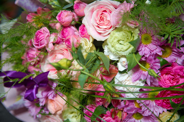 Red flower picture close up in the bouquet. The flower's petal . Bouquet of fresh red, white , pink roses . bouquet of multicolored roses .
