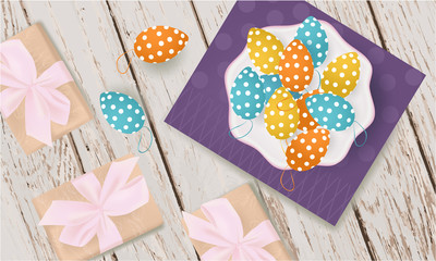 Easter banner with gift box, Easter Eggs, plate with Easter Eggs on a wooden table, holiday
