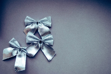 bows silver composition gray background. Christmas tree decorations