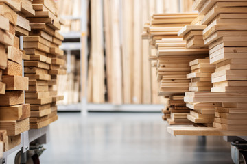 stacked wooden boards in a woodworking industry. stacks with pine lumber. folded edged board. wood...