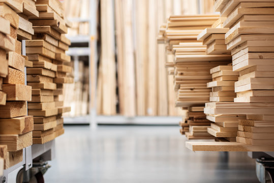 Stacked Wooden Boards In A Woodworking Industry. Stacks With Pine Lumber. Folded Edged Board. Wood Harvesting Shop. Timber For Construction