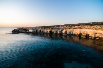 Blue lagoon in the Mediterranean on sunset, Cyprus cave