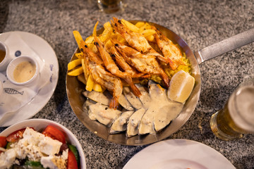 Seafood on the plate with sauce in restaurant