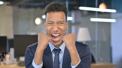 Portrait of Young Businessman Celebrating Success