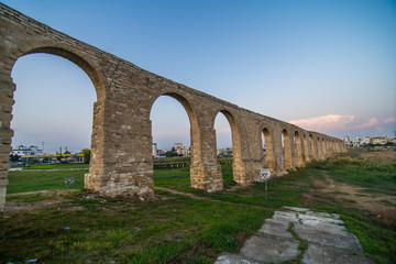 Fototapeta na wymiar Old Kamares aqueduct in city Larnaca, Cyprus.