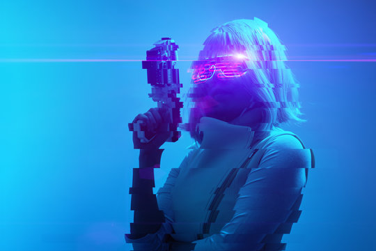 Girl with blaster in the futuristic battle. Concept virtual reality, cyber game. Image with glitch effect.