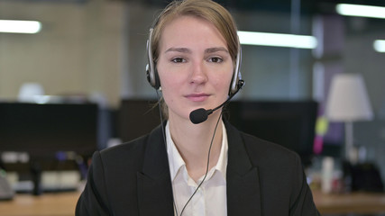Portrait of Young Businesswoman wearing Head Phones