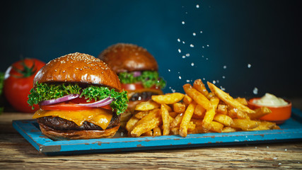 French fries fall next to cheeseburger, lying on vintage wooden cutting board, Freeze motion.