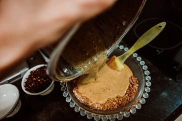 Beaten egg to mix it with healthy and natural ingredients to cook at home some oatmeal, chocolate and banana cookies without refined sugar. Real food. Lifestyle