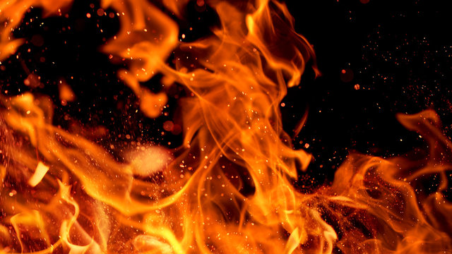 fire flames with sparks on a black background, close-up