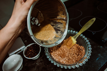 Beaten egg to mix it with healthy and natural ingredients to cook at home some oatmeal, chocolate and banana cookies without refined sugar. Real food. Lifestyle