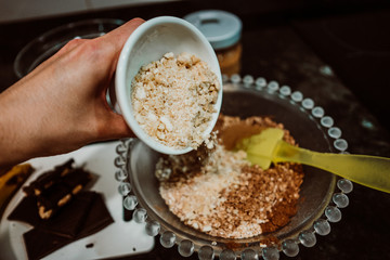 Process of mixing healthy and natural ingredients to cook at home some oatmeal, chocolate and banana cookies without refined sugar. Real food. Lifestyle