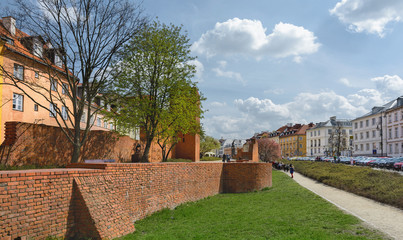 Warsaw Old city. Houses and city wall. Earthworks. Red brick city wall. Small street, Rycerska...