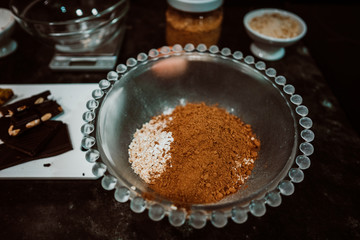 Process of mixing healthy and natural ingredients to cook at home some oatmeal, chocolate and banana cookies without refined sugar. Real food. Lifestyle