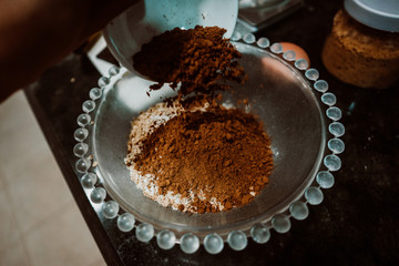 Process of mixing healthy and natural ingredients to cook at home some oatmeal, chocolate and banana cookies without refined sugar. Real food. Lifestyle