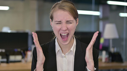 Portrait of Angry Young Businesswoman Shouting