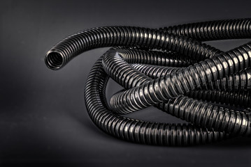All black - Black flex tube on black background