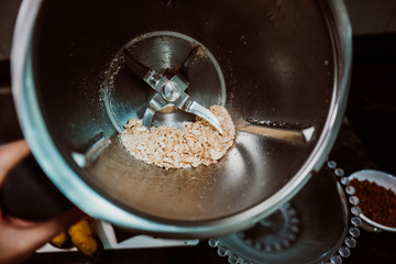 Process of mixing healthy and natural ingredients to prepare at home some oatmeal, chocolate and banana cookies without refined sugar. Real food. Lifestyle