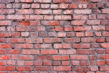 Close-up texture of the old red brick wall. Abstract background.