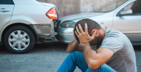 sad man with car accident