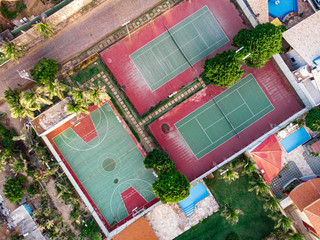 Aerial view of tennis field, red and green colored. 