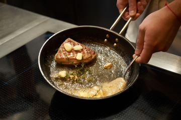 Chef cooking duck breast, close-up. Grilled poultry meat
