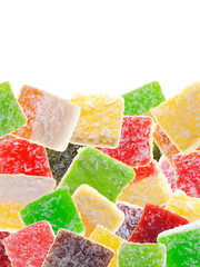 Candies are arranged randomly at the bottom of a vertical frame on a white background.