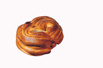 Fototapeta premium Freshly baked bun with a crispy crust close-up isolate on a white background.