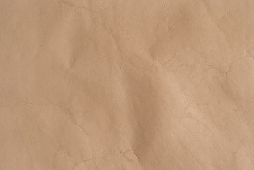 beige background and genuine leather
