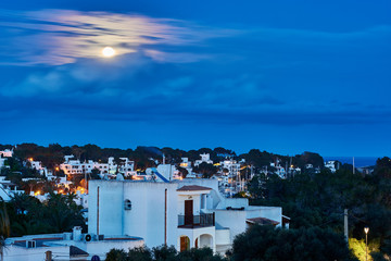 Cala d'or in the moonlight. Mediterranean village in the south east of Mallorca, Spain. Night scene.