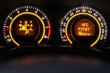 Dashboard close-up, car interior, red light