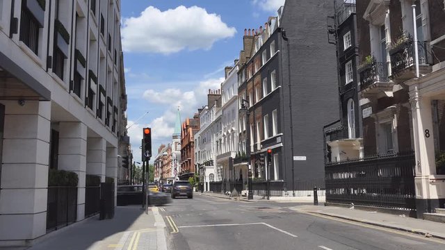 Time lapse. A street with apartments in the old district of London.