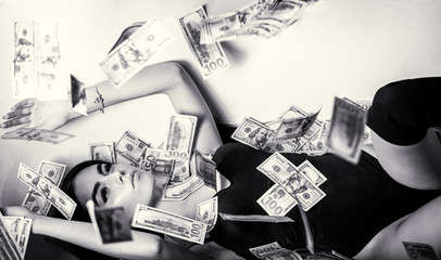 Woman with lot of money. Millionaire woman lying in bedroom. Rich sexy woman lies on money. Sexy woman lying in dollar bills. Black and white