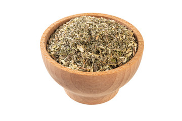 wormwood herb or in latin Absinthii herba herb in wooden bowl isolated on white background....