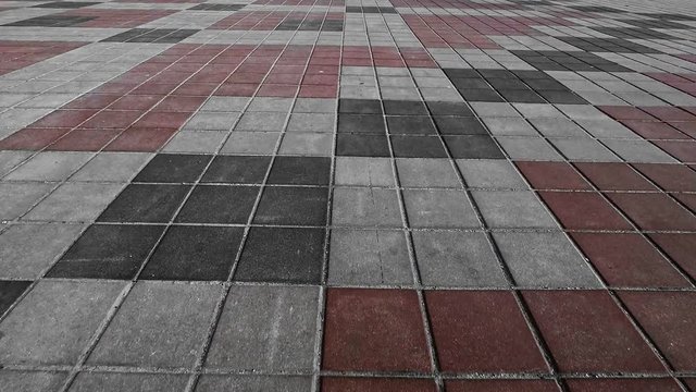 grey, red and black paving tile