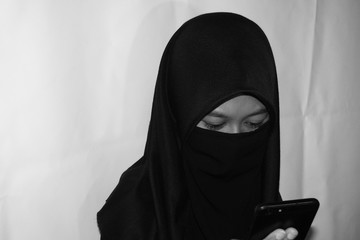 Close up view of Pretty lady woman girl wear hijab jilbab niqab kerudung niqaab scarf cover face...