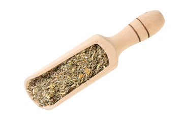 wormwood herb or in latin Absinthii herba herb in wooden scoop isolated on white background....